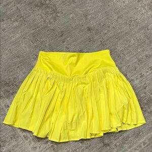 Bright yellow tennis or golf skirt
